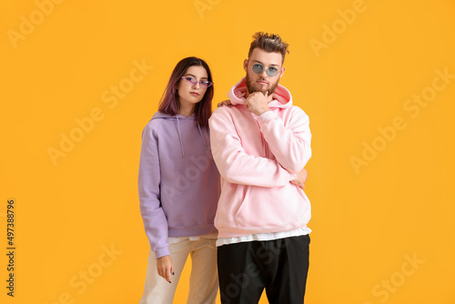 Cool young couple in hoodie...