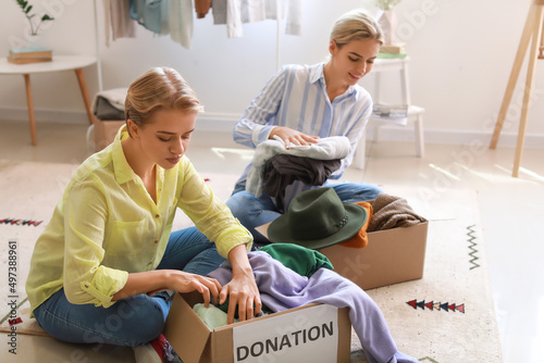 Young women putting clothes...
