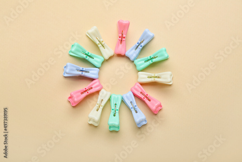 Plastic clothes pins on light background