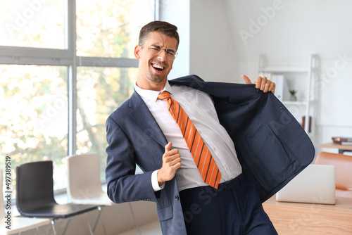 Dancing young businessman i...