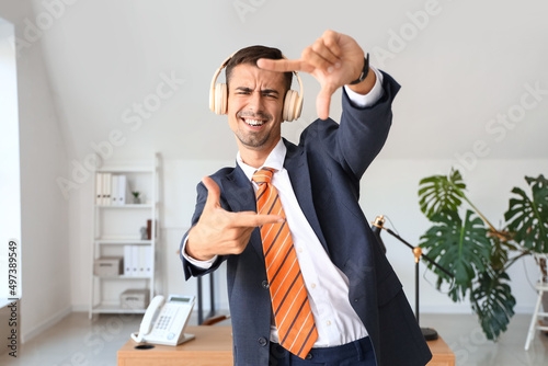 Dancing young businessman w...