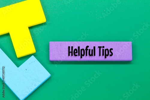 Colored puzzles with the word helpful tips. concept helpful tips