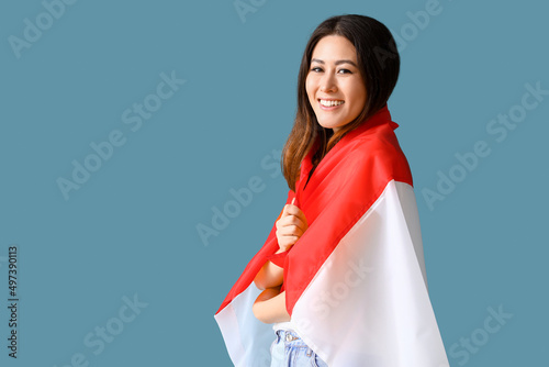 Young Asian woman with flag...