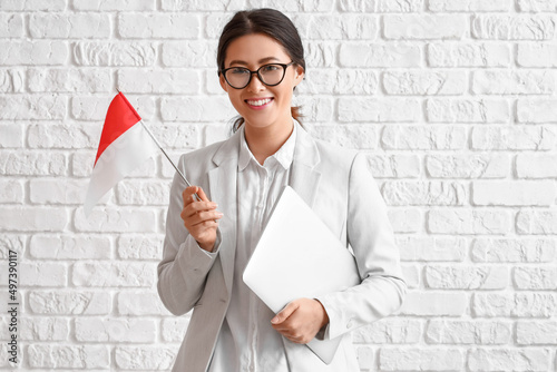 Young Asian woman with flag...