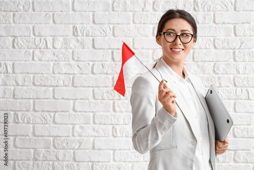 Young Asian woman with flag...