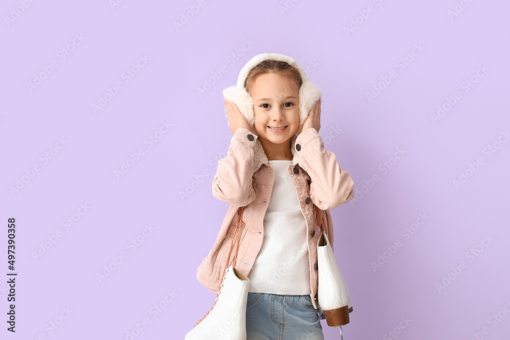 Cute little girl in winter clothes and with ice skates on color background Cute little girl in winter clothes and with ice skates on color background