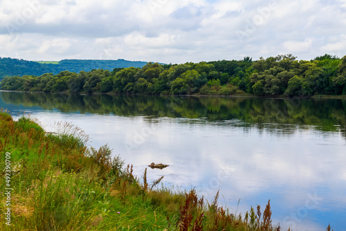 Wide river. Eastern european background with copy space for text or lettering. Ideal for fishing and rafting. photo
