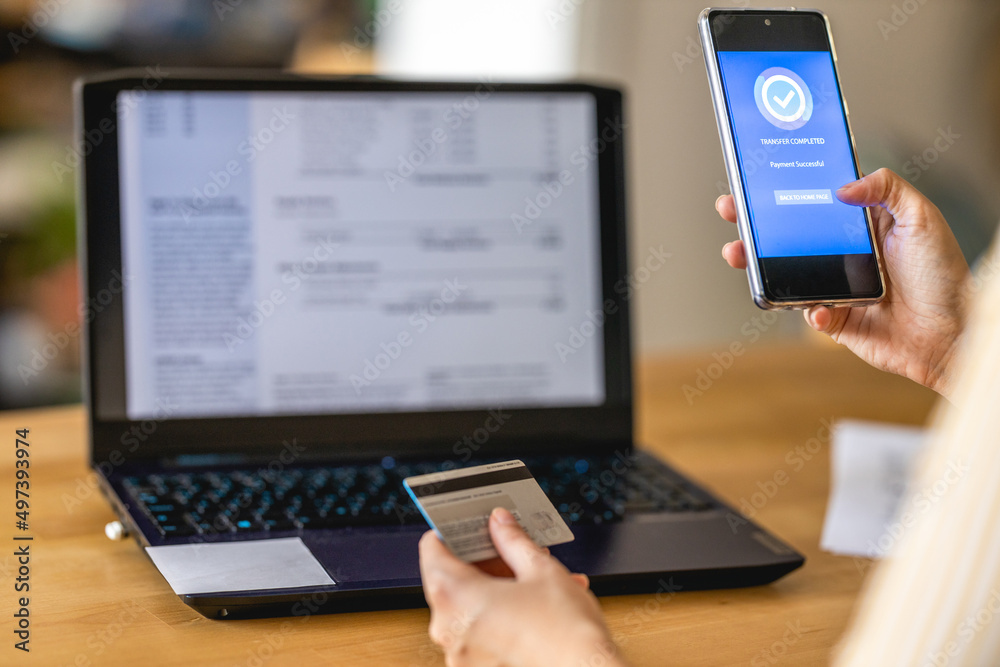 Young woman Paying Bills with mobile phone Young woman Paying Bills with mobile phone