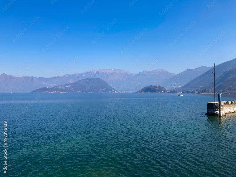 Fototapeta premium Bergamo, Italy: 10-02-2022: Panoramic of Lake Iseo, the fourth largest&nbsp;lake&nbsp;in&nbsp;Lombardy, Italy, fed by the&nbsp;Oglio River.