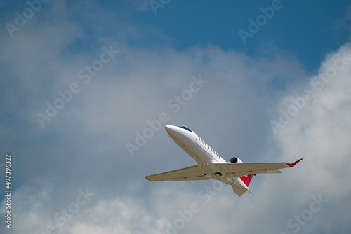 Small Private Jet Taking Off At Airport Runway