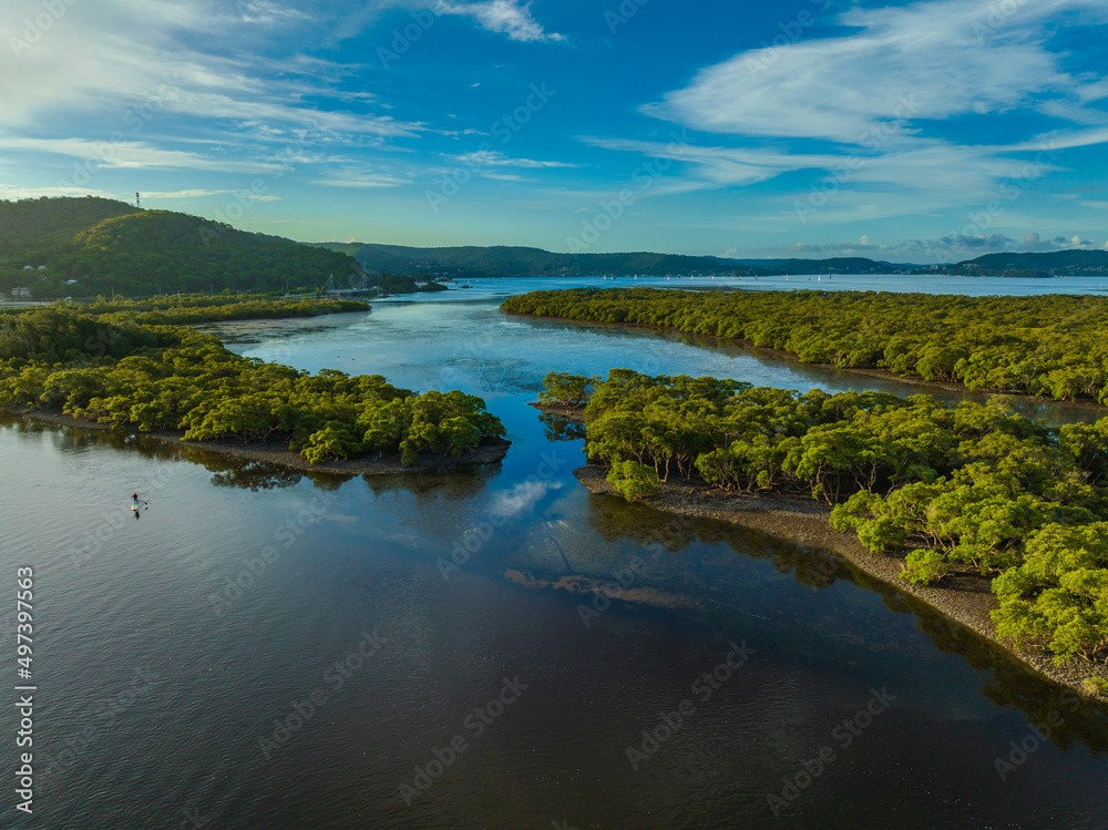 Obraz premium Early evening flight over the bay