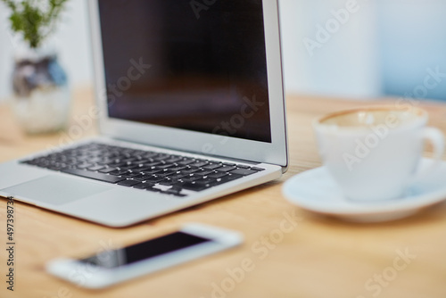 Business essentials. Still life shot of a laptop at a workstation in an office.