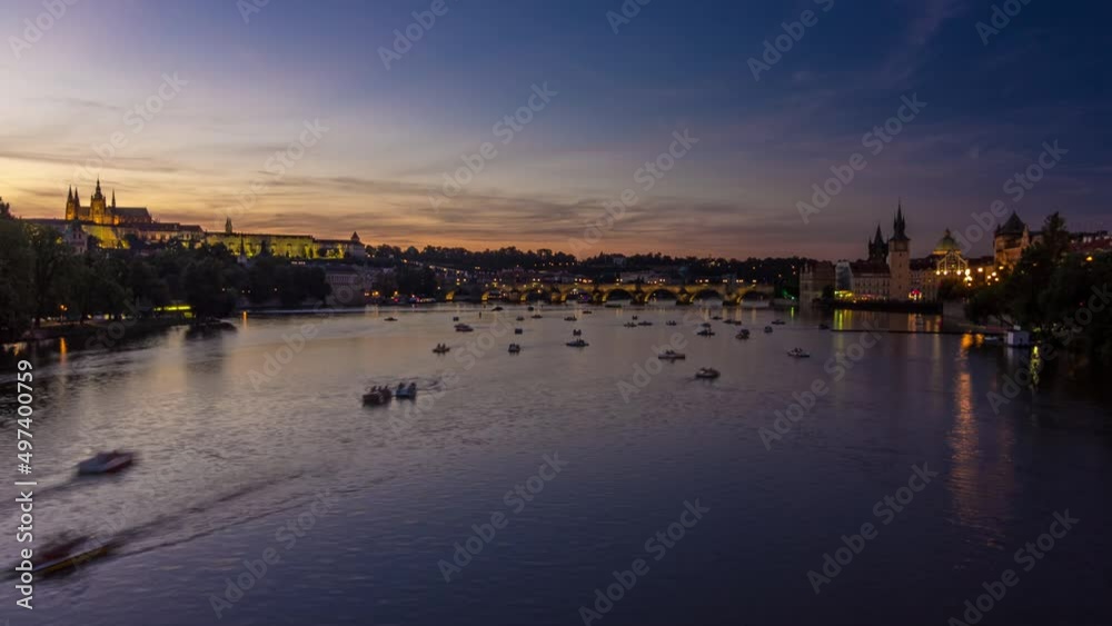 View of the city Prague in Czech Republic day to night timelapse on the Vltava river with beautiful sky View of the city Prague in Czech Republic day to night timelapse on the Vltava river with beautiful sky