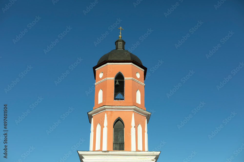 Bell tower of temple. Orthodox church. Religious building.