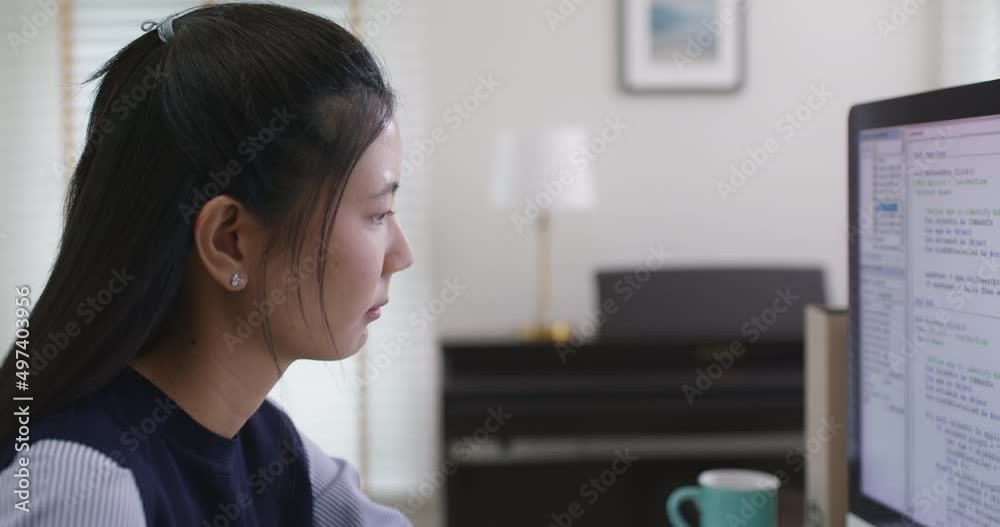 Chronic burnout in software engineer tired solving problem fix bug work hard at home office desk. Coder job for young asian talent woman cloud computing cyber security reskill upskill for workforce.