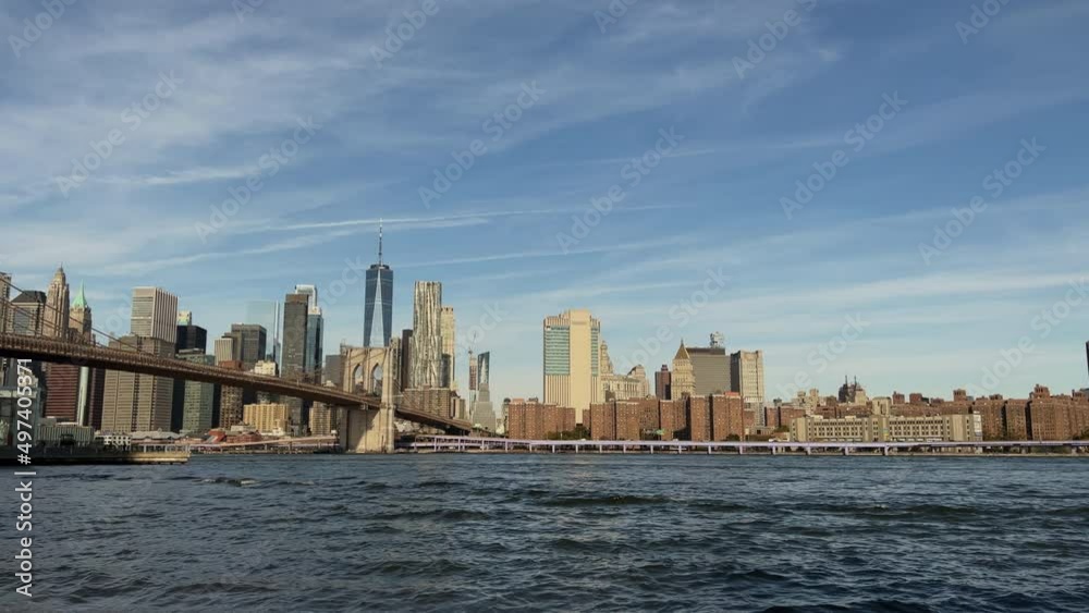 New York city. East river, Brooklyn bridge and downtown Manhattan. Pebble beach. New York city. East river, Brooklyn bridge and downtown Manhattan. Pebble beach.