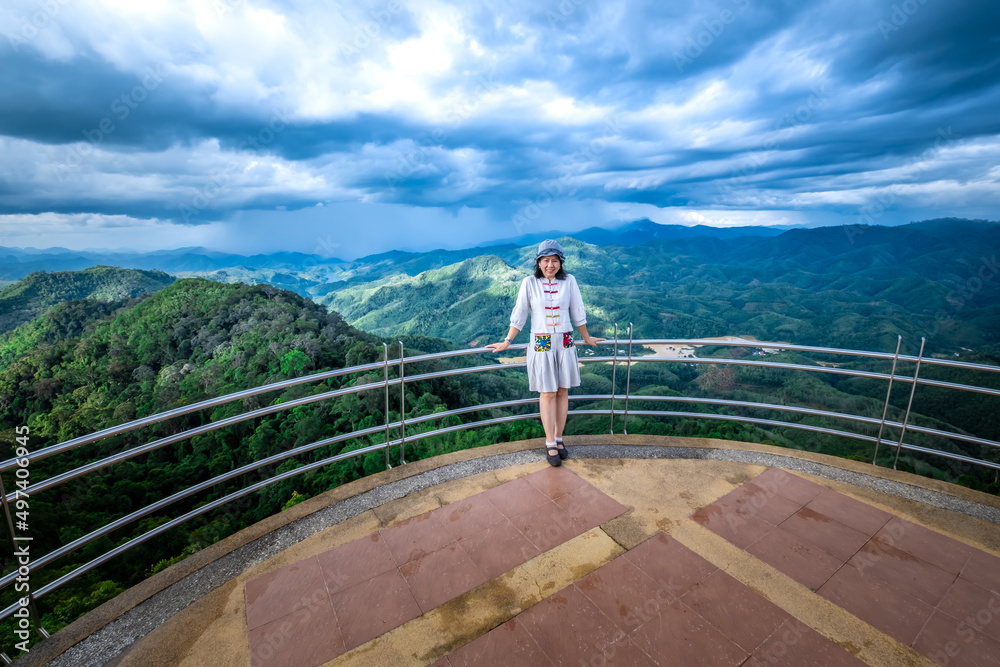 Woman standing on the viewpoint of Aiyoeweng, Betong, Yala Province, Thailand.
