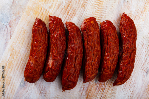 Roasted chezh sausages susena on cutting board. High quality photo photo