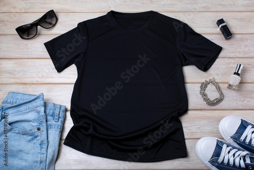 Womens  black T-shirt mockup with blue jeans, nail polish