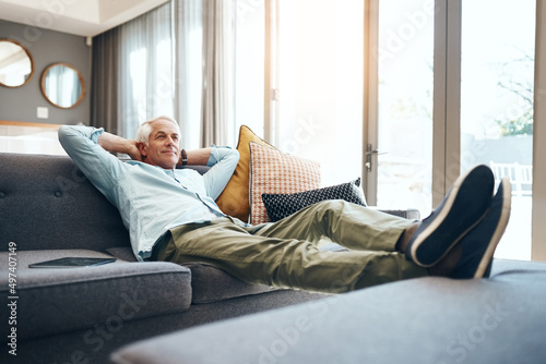 In the home zone. Shot of a senior man relaxing on the sofa at home. © Camerene Pendl/peopleimages.com