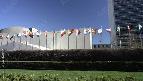 Flags flying at the United Nations Headquarter in New York City. Slow Motion flags in the wind. Qatar, Poland, South Korea flags