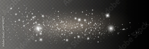 The dust sparks and golden stars shine with special light. Vector sparkles on a transparent background. Christmas light effect.