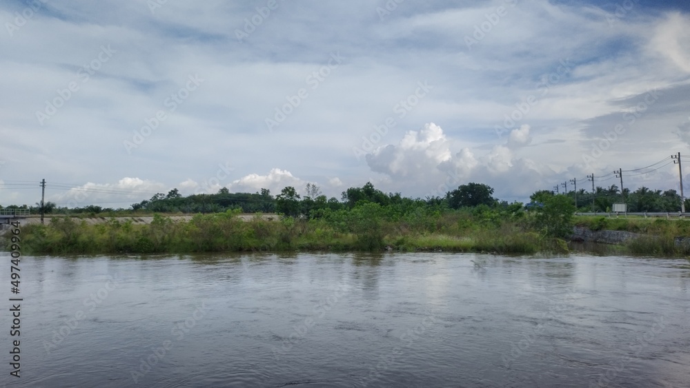 clouds over lake river and sky  in the rainforest in Southeast Asia