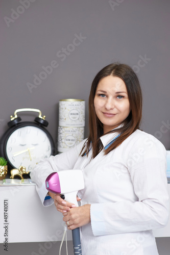 portrait of a young woman in a salon of laser epilation.