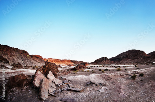 Its a vast and barren landscape. Shot of rugged desert terrain.