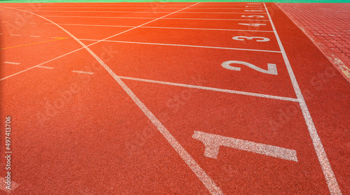 Outdoor stadium. Treadmill  tracks for running in a street stadium, close-up. Competition concept, finish or start