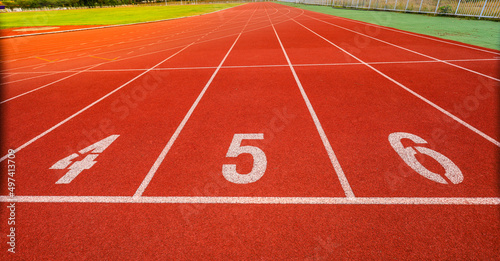 Outdoor stadium. Treadmill tracks for running in a street stadium, close-up. Competition concept, finish or start