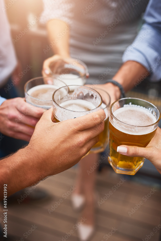 Cheers to the week and the weekend. Cropped shot of an unrecognizable group of businesspeople having drinks on their office balcony. Cheers to the week and the weekend. Cropped shot of an unrecognizable group of businesspeople having drinks on their office balcony.