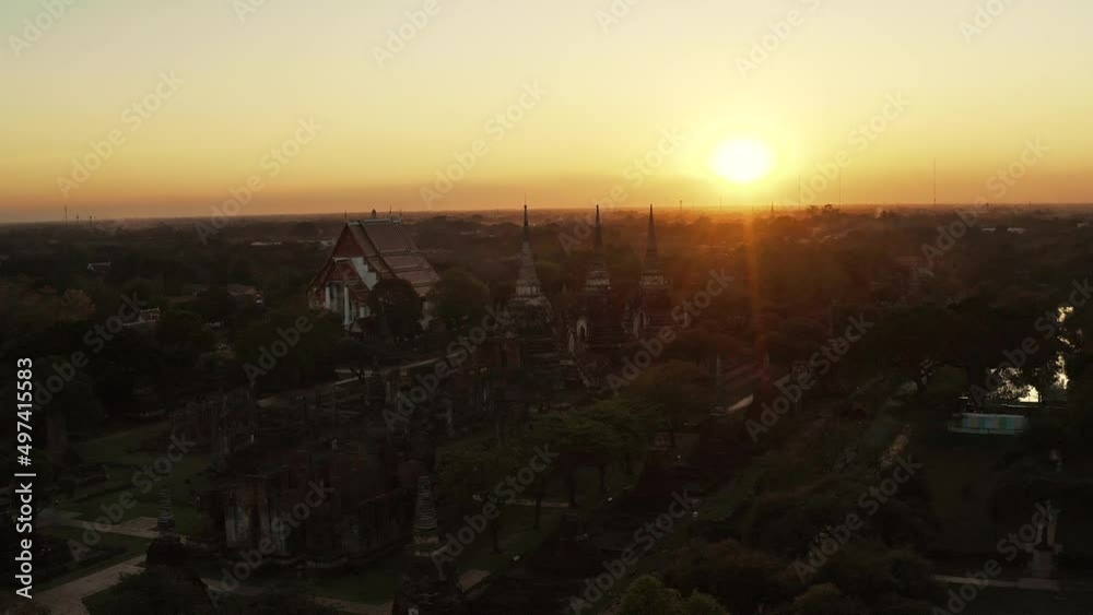 Aerial drone shot of buddhist temple Wat Phra Si Sanphet from above during the sunset - Ayutthaya, Thailand