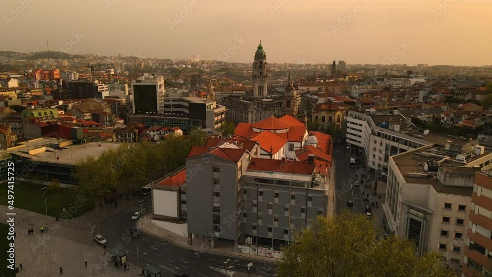 Side Facade of Hospital da Ordem da Trindade With the Camara Municipal do Porto in the Background During Sunset in Porto Portugal - Descending Aerial Shot