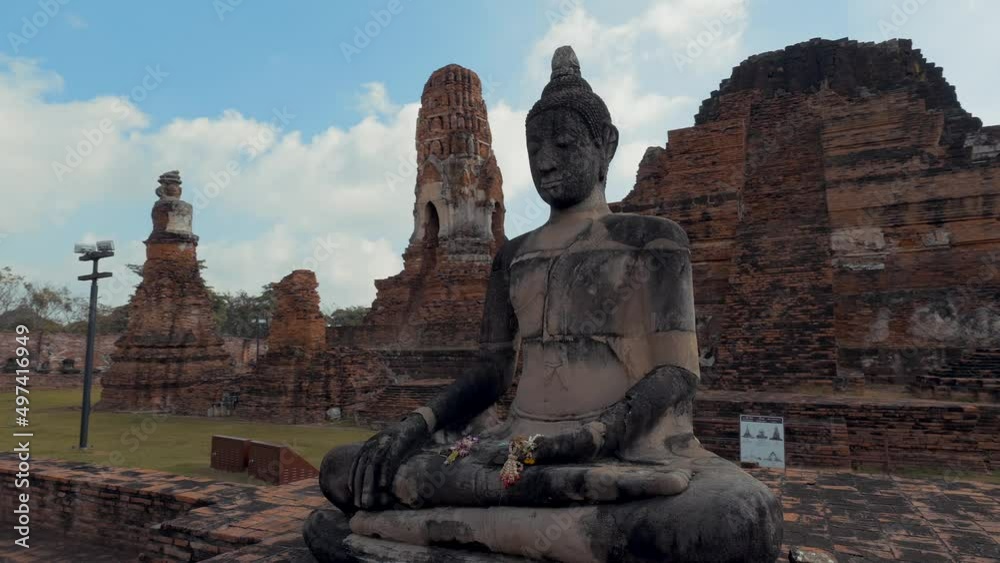 Rotation around a old statue of Buddha - Ayutthaya, Thailand Rotation around a old statue of Buddha - Ayutthaya, Thailand
