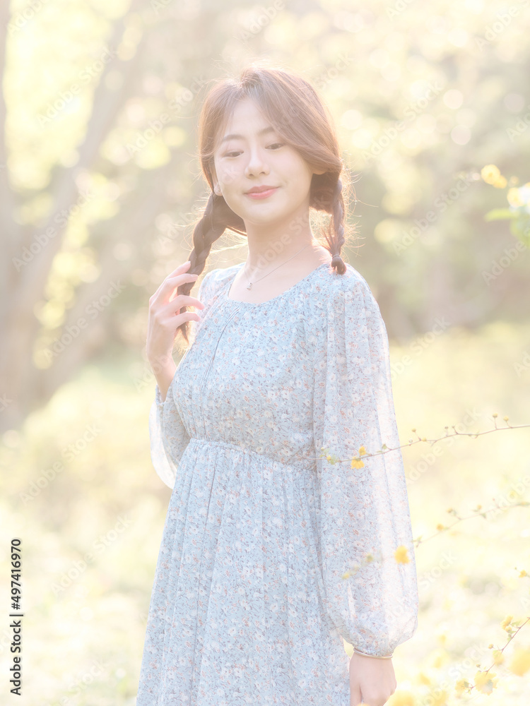Portrait of elegant Chinese girl in dress enjoy carefree time in forest park in sunny day. Outdoor fashion portrait of glamour young Chinese cheerful stylish woman. Portrait of elegant Chinese girl in dress enjoy carefree time in forest park in sunny day. Outdoor fashion portrait of glamour young Chinese cheerful stylish woman.