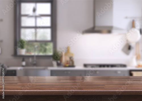 Wood table on blur kitchen room background. For montage product display or design key visual layout