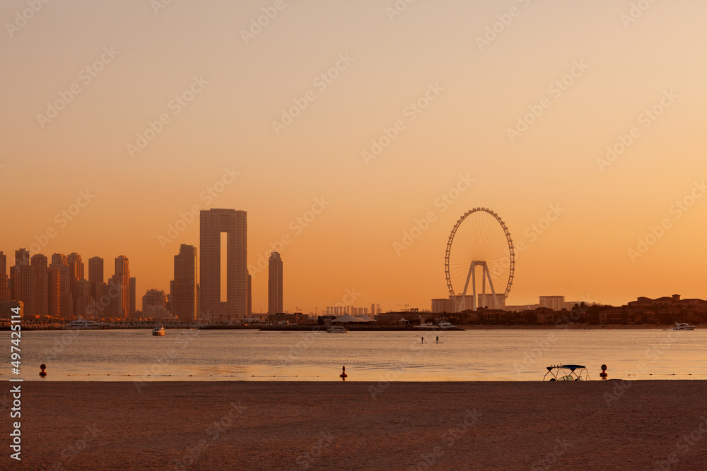 Obraz premium Sunset over the island of Blue Waters with the famous Dubai Eye Ferris wheel