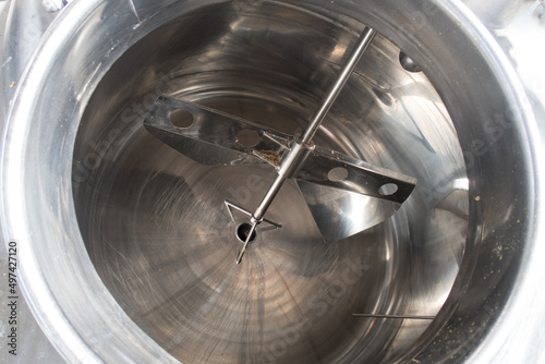 Close up on beer brewery tools inside a brewing facility, no people are visible. photo