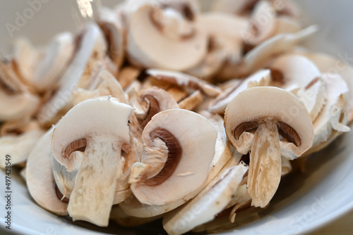 sliced quality White organic Mushrooms. plant based cooking ingredients. vegan and vegetarian cuisine. food preparation