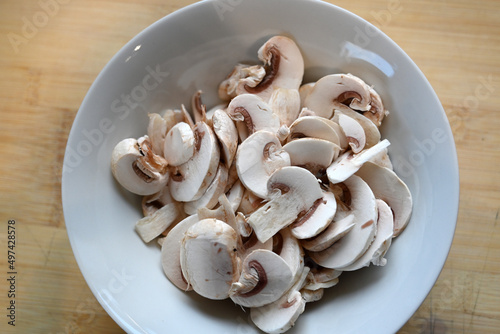 sliced quality White organic Mushrooms. plant based cooking ingredients. vegan and vegetarian cuisine. food preparation