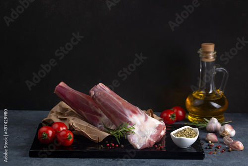 Raw lamb shanks meat on a m...