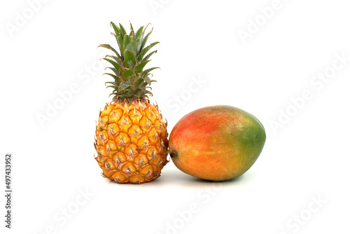 Pineapple and multicolored mango isolated on a white