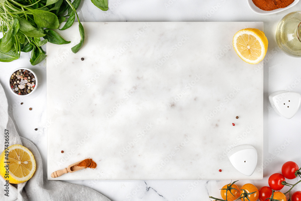 White food background with empty white stone board. Free space for text