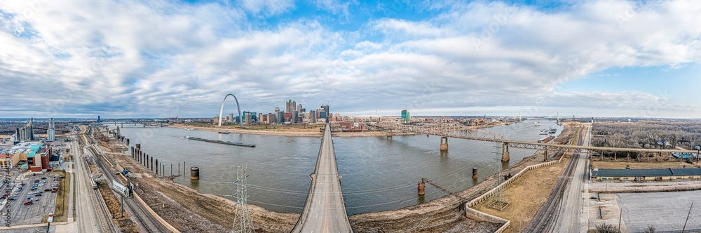 Drone panorama over St. Louis skyline and Mississippi River with Gateway Arch during daytime