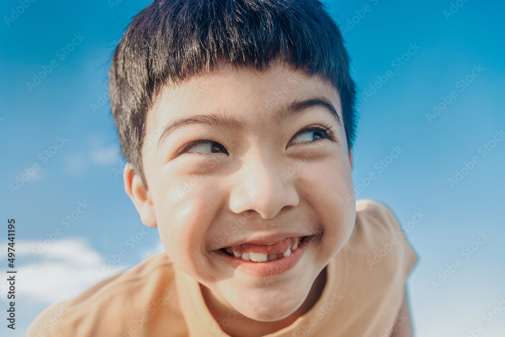 Happy Little Asian boy happy, Kid showing front teeth with big smile and  laugh: funny smiley healthy smiley face cute kid.Joyful boy of Asian  elementary school students. Stock Photo | Adobe Stock