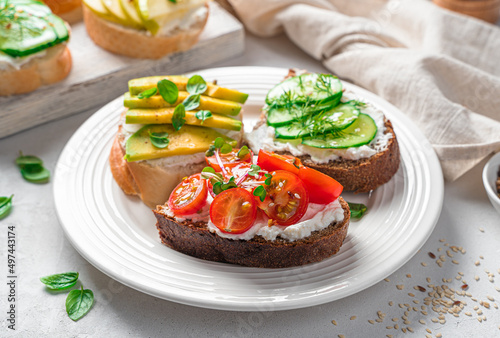Wallpaper Mural Crostini on rye and wheat bread with feta, vegetables, fruits and fresh herbs. Torontodigital.ca