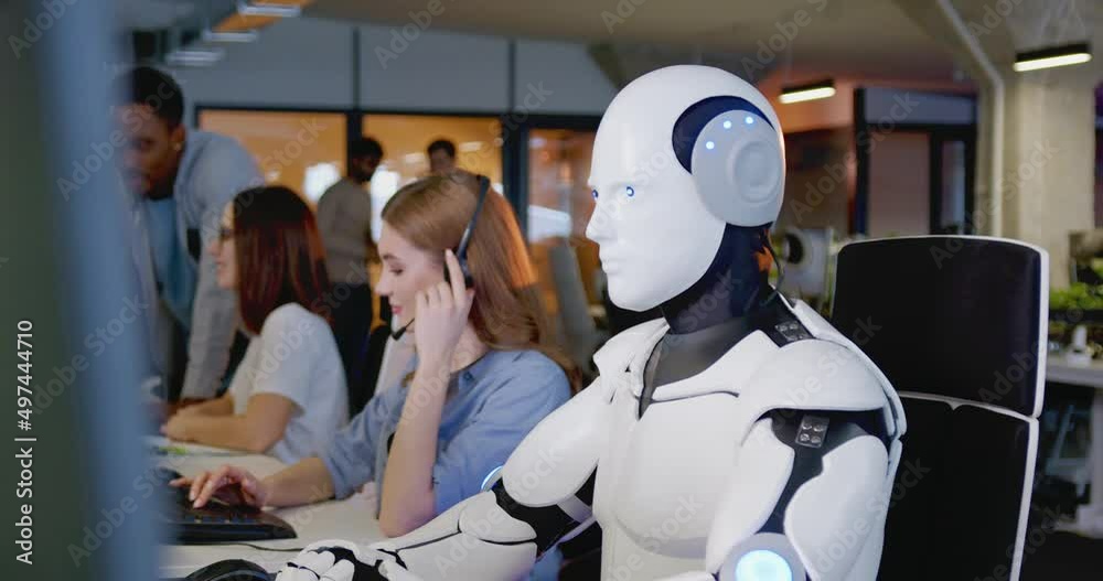 Portrait of robot looking at camera in office. White android turning head and looking straight. Humanoid working at computer in call center. Support worker.