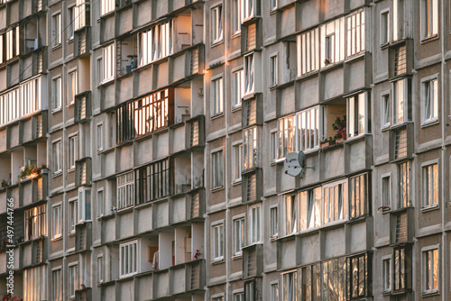 Reflection of a sunset in Soviet multistory building windows in Riga, Latvia