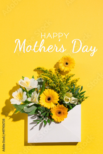 Yellow and white flowers on paper yellow background. Spring, Easter card concept
